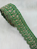 Green lace with intricate Cutdana and Jari handwork, showcasing detailed embroidery and delicate craftsmanship.