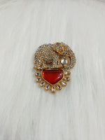 Golden metal and stonework elephant brooch featuring intricate design, handcrafted by Lace Hut.