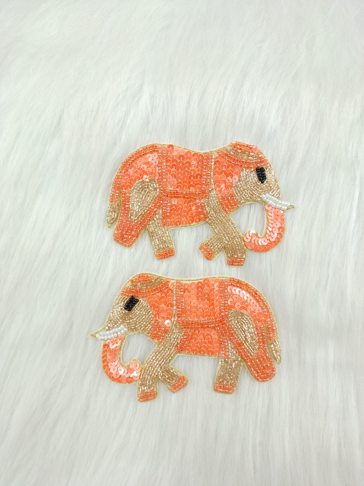 Peach elephant patch with Zardosi, sequins, and handwork embroidery by Lace Hut, featuring intricate detailing on fabric.