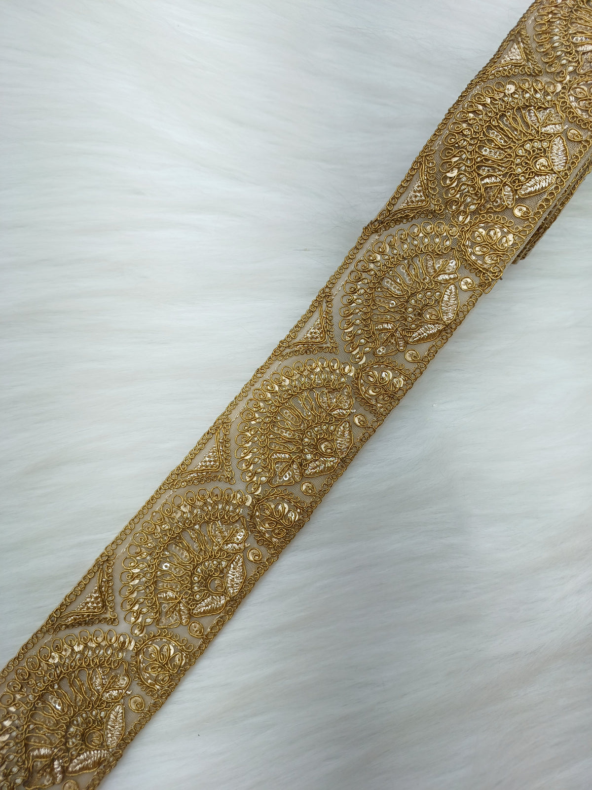 Antique gold lace trim from Jari Work by Lace Hut, showcasing intricate floral lace design on a neutral background.