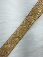 Antique gold lace trim from Jari Work by Lace Hut, showcasing intricate floral lace design on a neutral background.