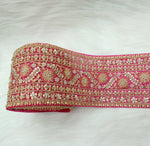 Rani pink lace with cutdana and moti handwork on net base, detailed close-up of intricate embroidery by Lace Hut.