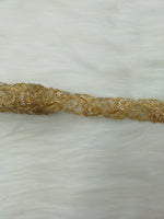 Golden Cutdana handwork lace with intricate cutwork design, crafted by Lace Hut for elegant fabric embellishments.