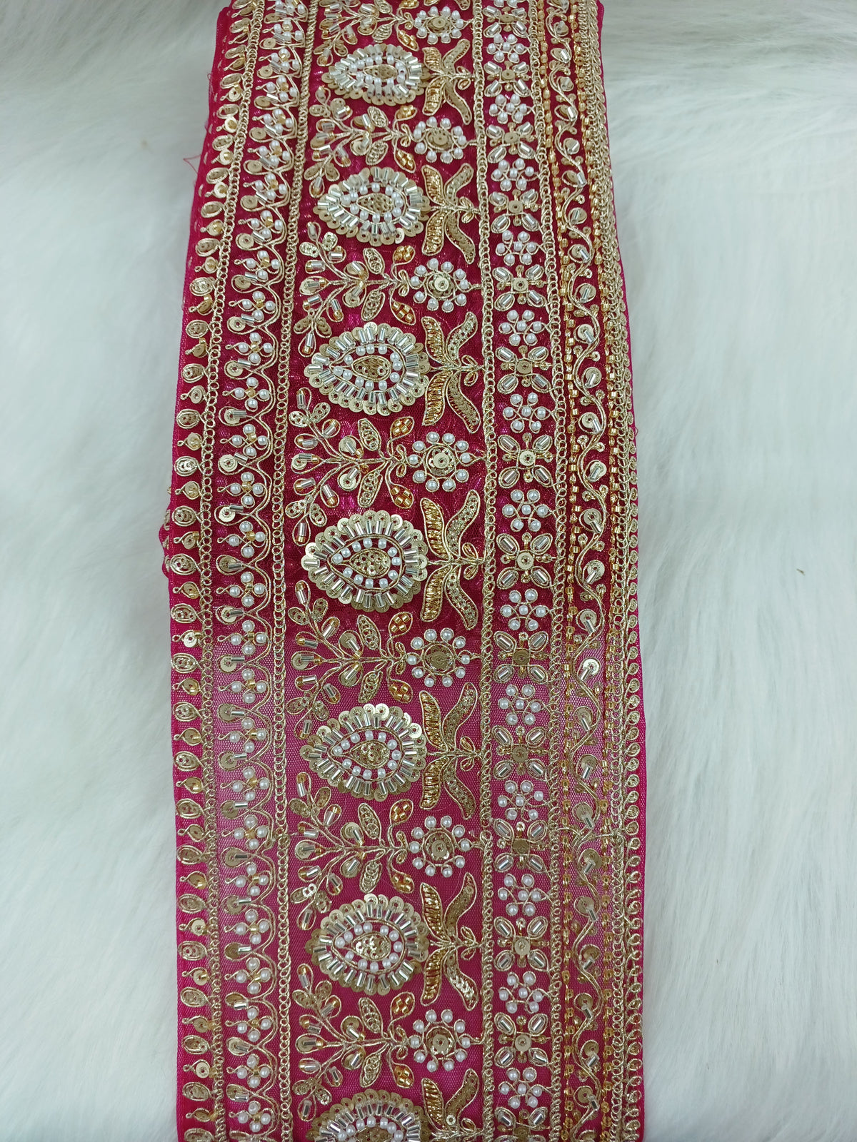 Magenta pink lace with cutdana and moti handwork, intricate embroidery by Lauce-Hut for elegant traditional dress embellishment.