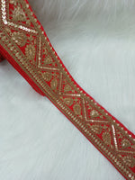 Red Aari work lace from Lauce-Hut featuring intricate embroidery and delicate floral patterns.