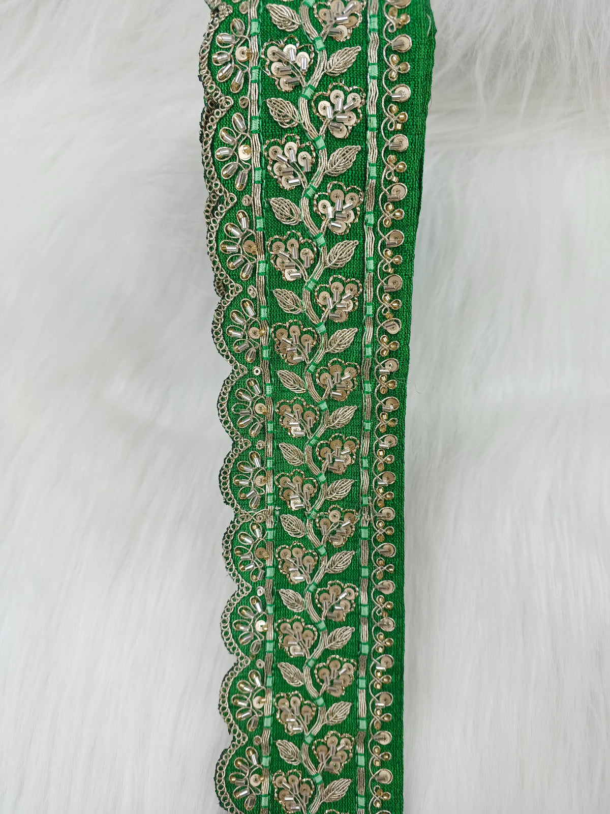 Green lace with cutdana and jari handwork from Lauce-Hut, showcasing intricate floral embroidery and detailed craftsmanship.