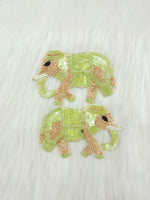 Light green Zardosi poth and sequence handwork with elephant patch on fabric, showcasing intricate embroidery and detail.