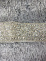 Silver lace with cutdana and moti handwork from Lace Hut, featuring intricate embroidery and delicate design.