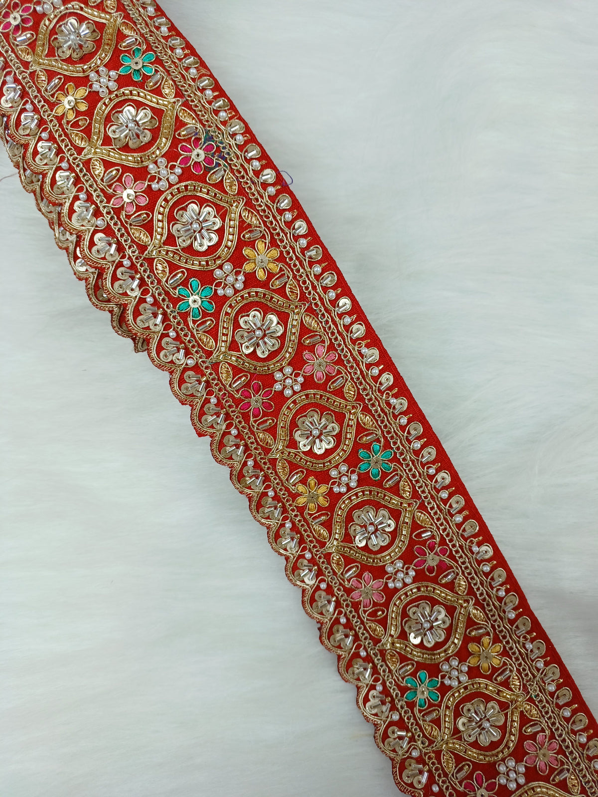 Colorful Lauce-Hut Cutdana Moti handwork lace with red base, featuring intricate embroidery and multi-color bead accents.