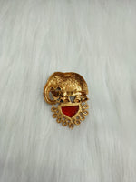 Golden metal and stonework elephant brooch with intricate details, showcasing a stylish accessory from Lace Hut.