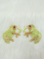 Light green elephant patch with Zardosi, bead, and sequins handwork on fabric, showcasing intricate embroidery and detailed embellishments.