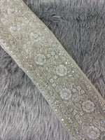 Silver lace with intricate cutdana and moti handwork, detailed close-up of Lace Hut's elegant silver embroidered lace.