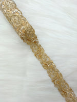 Golden cutdana handwork lace with intricate cutwork design from Lace Hut, showcasing detailed embroidery on fine fabric.