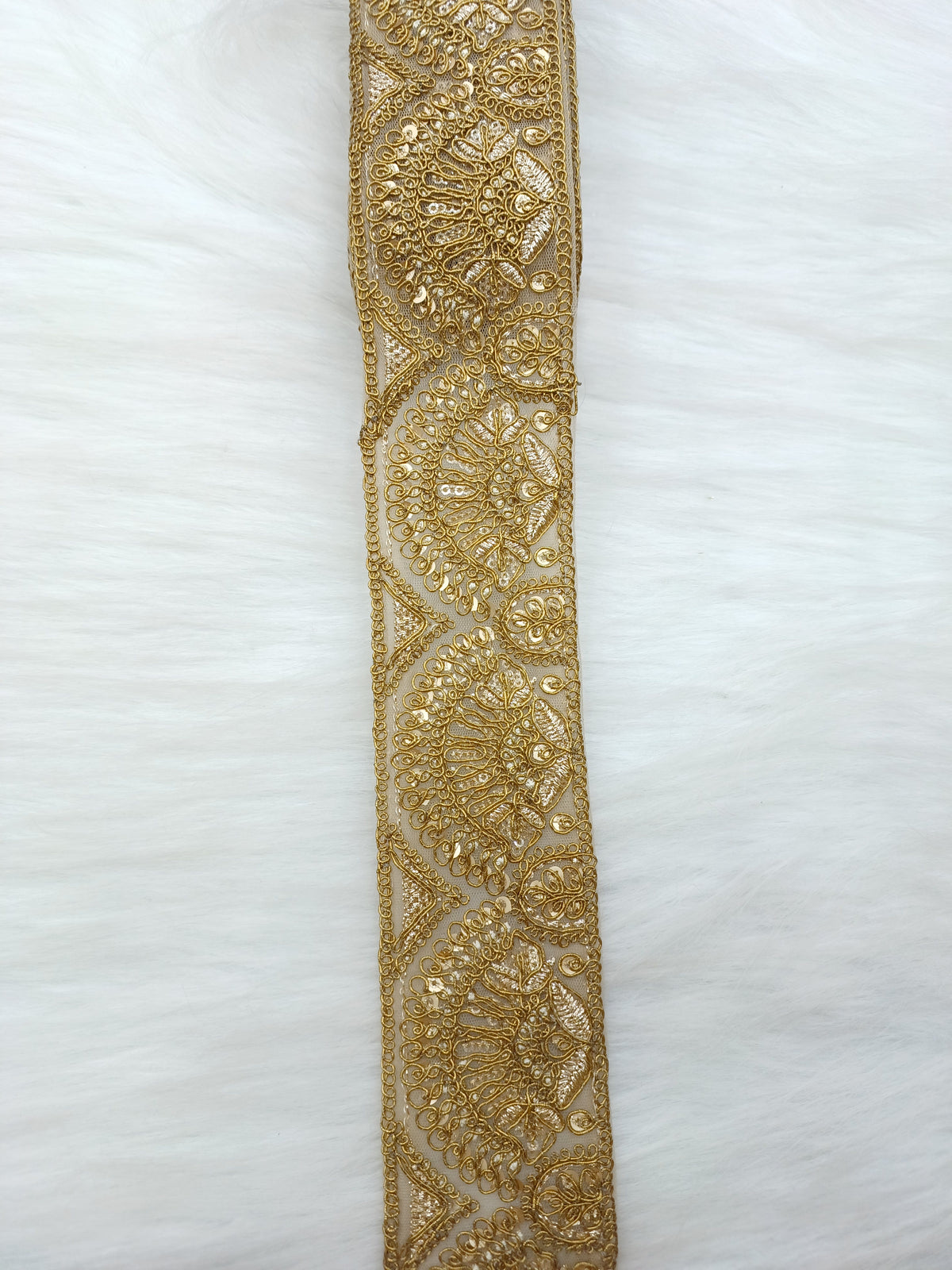 Antique gold lace fabric with intricate floral patterns, showcasing the delicate design of Jari Work from Lace Hut.