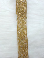 Antique gold lace fabric with intricate floral patterns, showcasing the delicate design of Jari Work from Lace Hut.