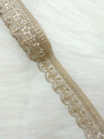 Gold water lace with scallop edges featuring cutdana and moti handwork, designed by Lace Hut for elegant embellishments.