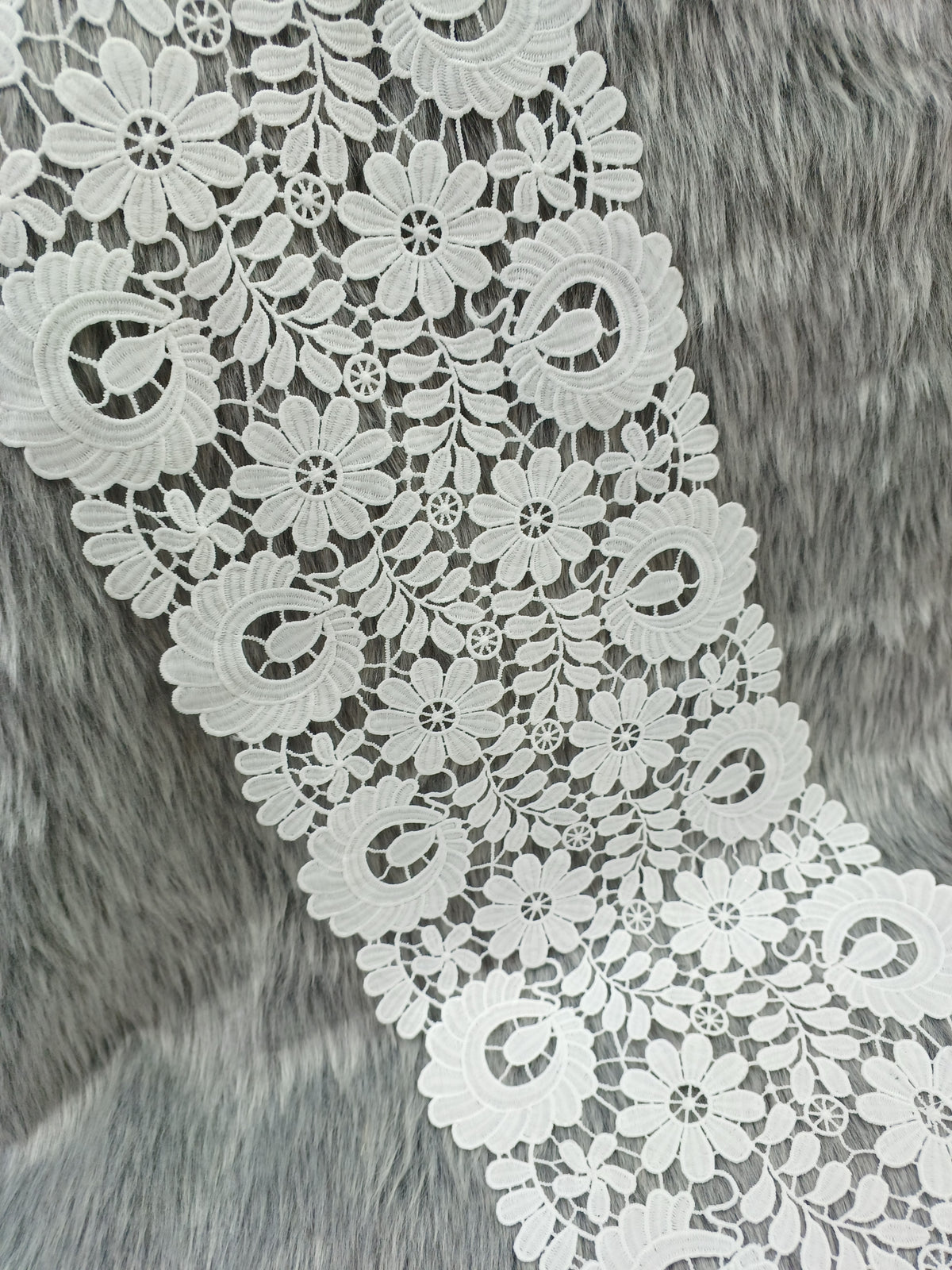 Close-up of Xyz flower cut work cotton lace fabric showcasing intricate floral embroidery and delicate lace pattern.