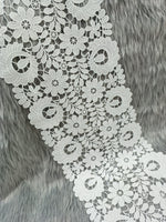 Close-up of Xyz flower cut work cotton lace fabric showcasing intricate floral embroidery and delicate lace pattern.