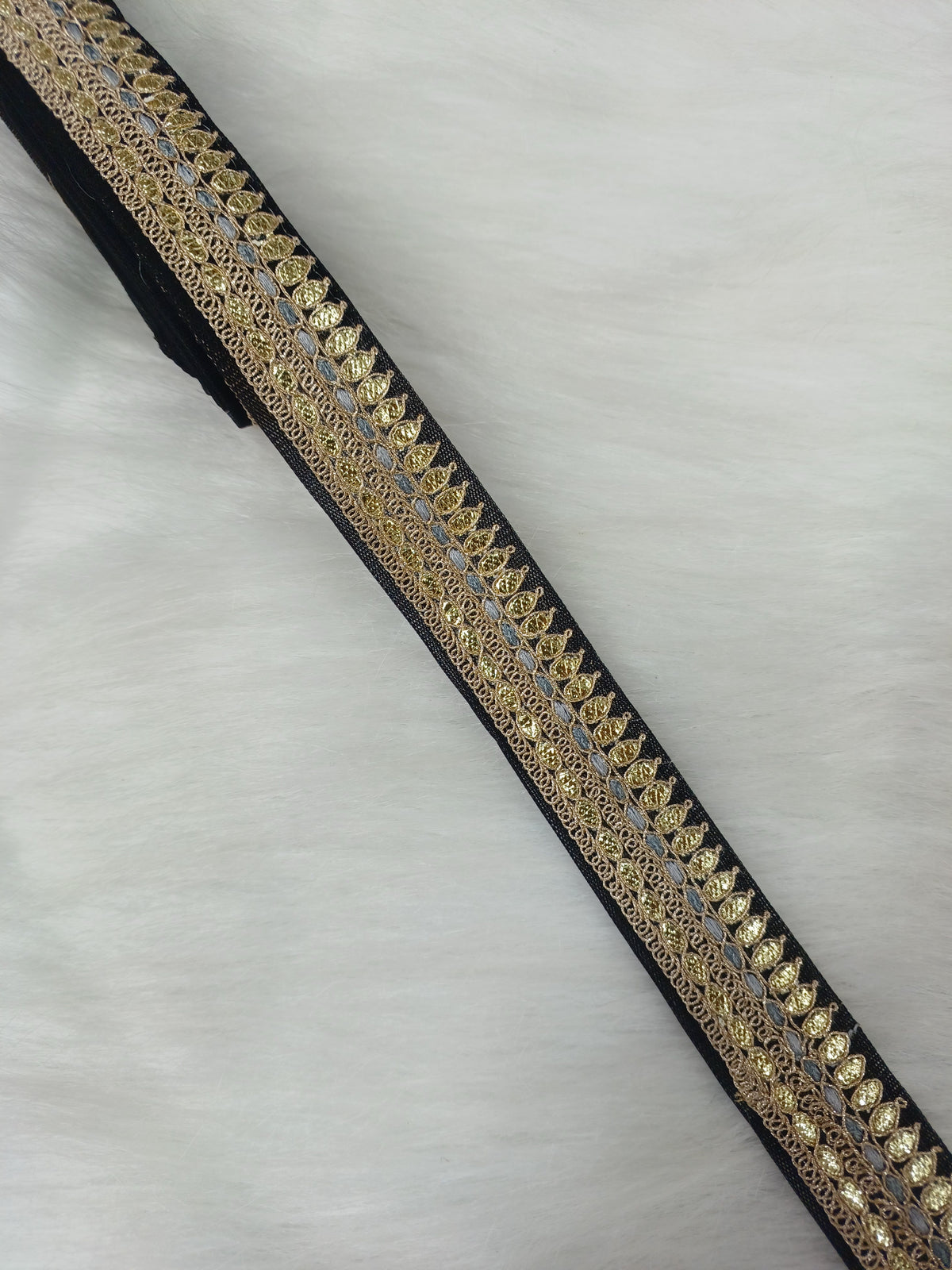 Black lace with Gota Patti work from Lace Hut, showcasing intricate embroidery and delicate design on elegant fabric.