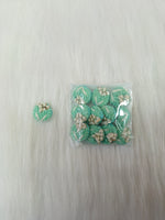 Sea green crochet handwork button from Lace Hut, featuring intricate design and a round shape with a glossy finish.
