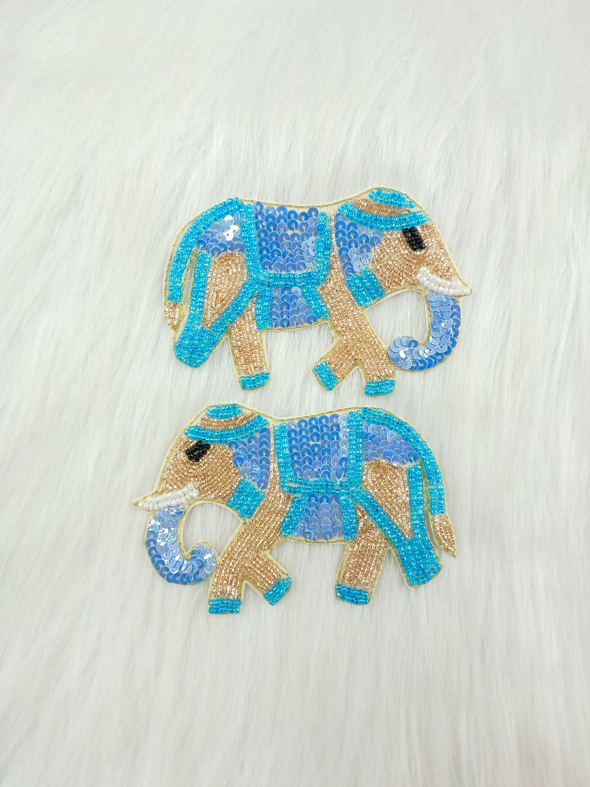 Blue elephant patch with Zardosi, poth, and sequence handwork by Lace Hut, showcasing intricate embroidery on fabric.