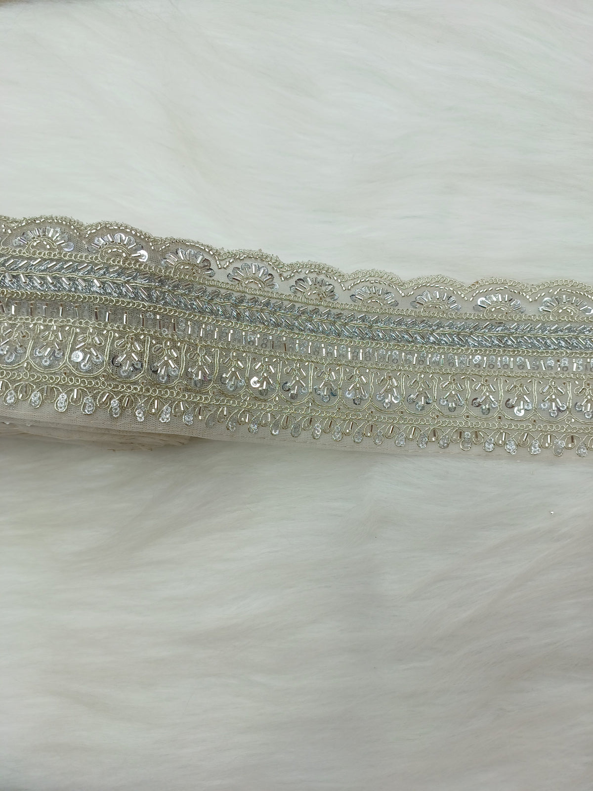 Silver lace with intricate cutdana handwork from Lace Hut, showcasing detailed embroidery and delicate craftsmanship.