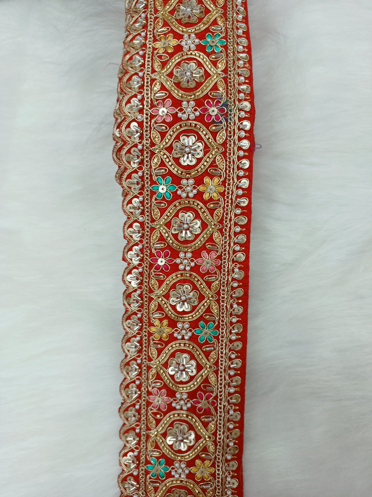 Colorful Cutdana moti handwork lace with red base, multi-color embroidery by Lauce-Hut, showcasing intricate design and craftsmanship.