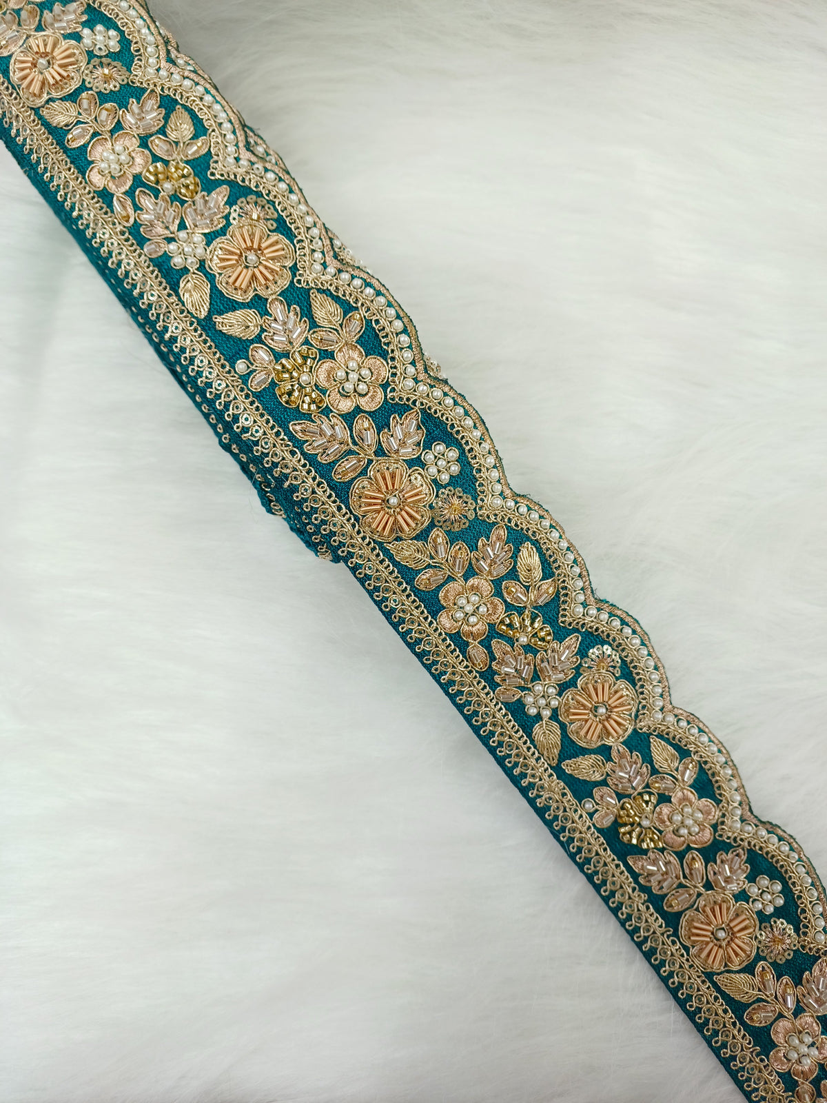 Rama green lace with cutdana moti and zardosi handwork, featuring intricate embroidery and decorative embellishments.