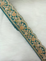 Rama green lace with cutdana moti and zardosi handwork, featuring intricate embroidery and decorative embellishments.