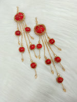 Red lehenga latkan with Zardosi cutdana and crystal handwork, featuring intricate embroidery and decorative tassels.