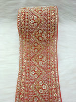 Red lace with cutdana and moti handwork on net base from Lace Hut, showcasing intricate embroidery and detailed design.