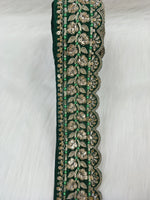 Bottle green lace with intricate cutdana jariwork, detailed embroidery, and delicate floral patterns from Luce-Hut.