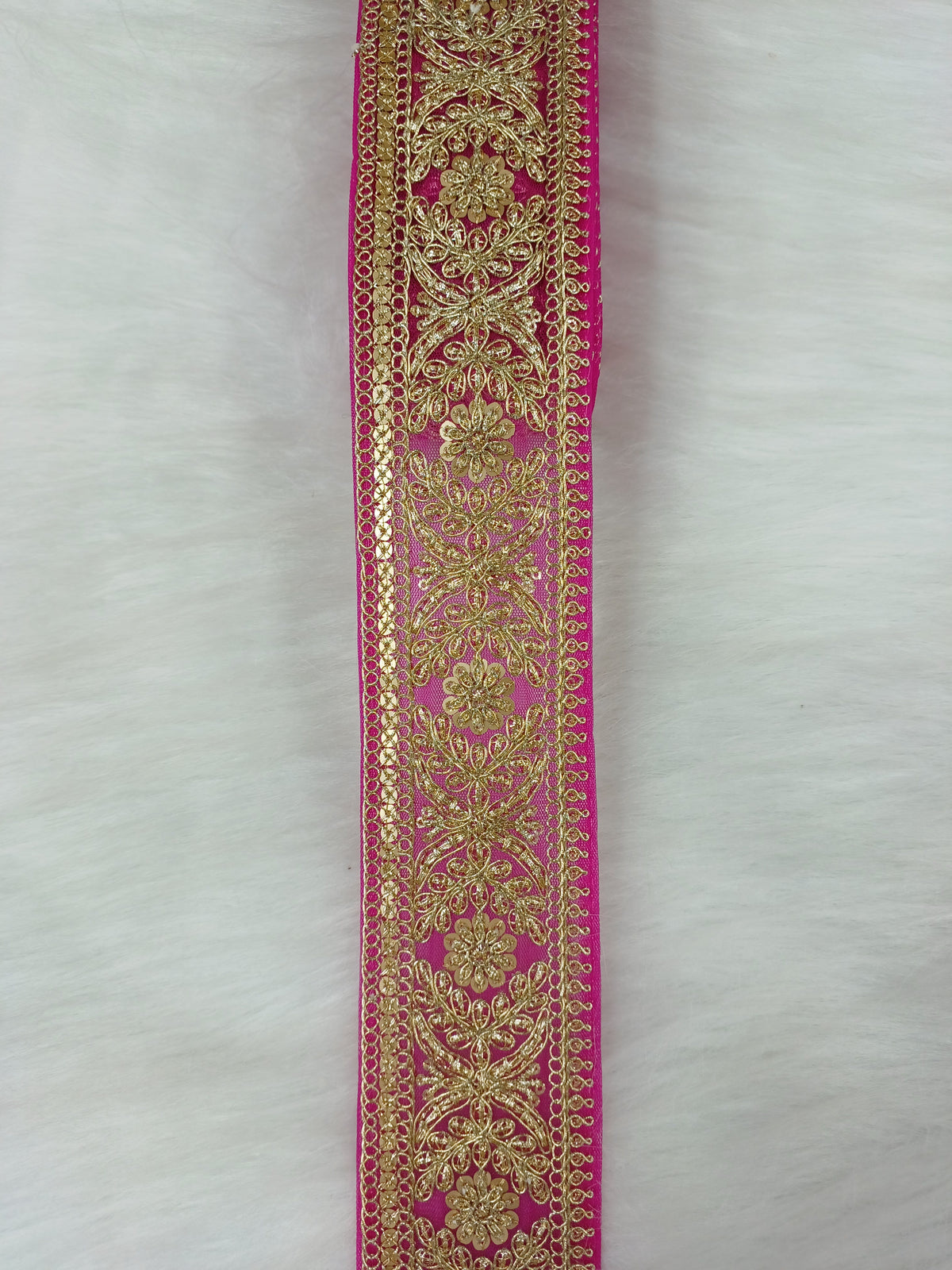 Magenta pink lace Jari work net base fabric by Lace Hut, showing intricate floral patterns and delicate embroidery details.