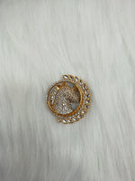 Golden metal and stonework horse brooch from Lace Hut with intricate detailing and elegant design.