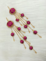 Magenta Zardosi, cutdana, and crystal handwork lehenga latkan with intricate embroidery and hanging embellishments.