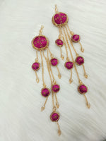 Magenta Zardosi, cutdana, and crystal handwork lehenga latkan with intricate embellishments and vibrant colors.