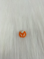 Orange crochet handwork button by Lace Hut featuring intricate design and a single prominent button for sewing or embellishments.