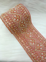 Red lace with cutdana and moti handwork on net base, intricate lace design with embellishments, by Lace Hut.