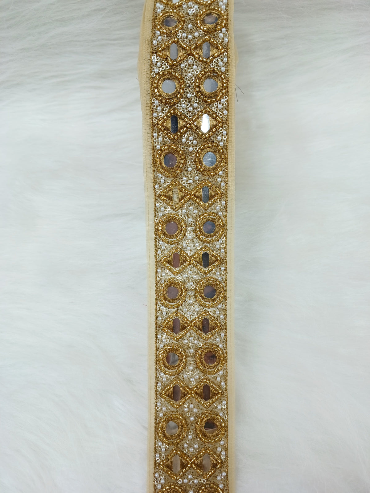 Antique golden cutdana handwork plastic mirror lace featuring intricate design, perfect for traditional decor and craft projects.