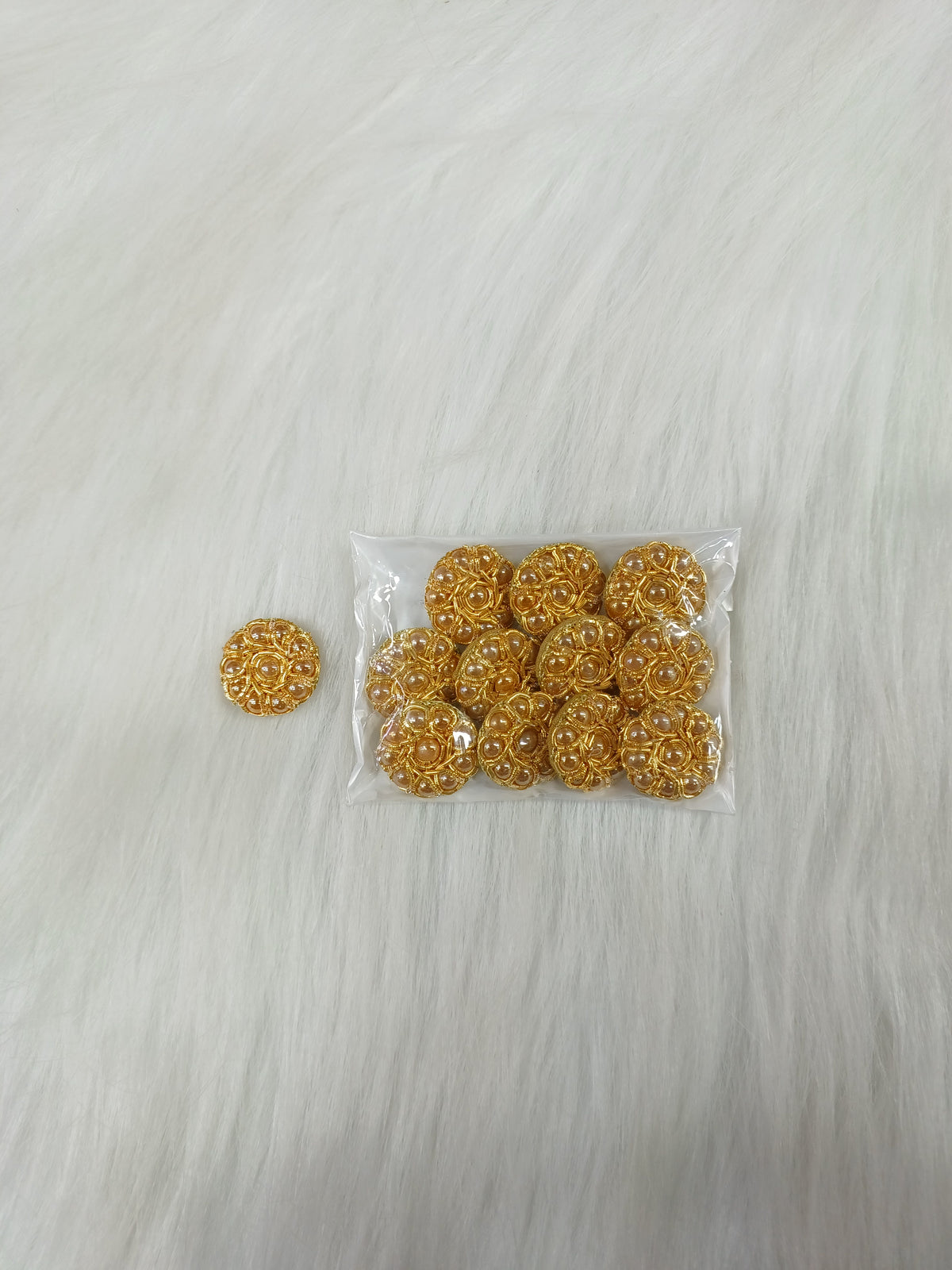 Bright golden Zardosi and moti handwork button with intricate design, perfect for traditional Indian garments