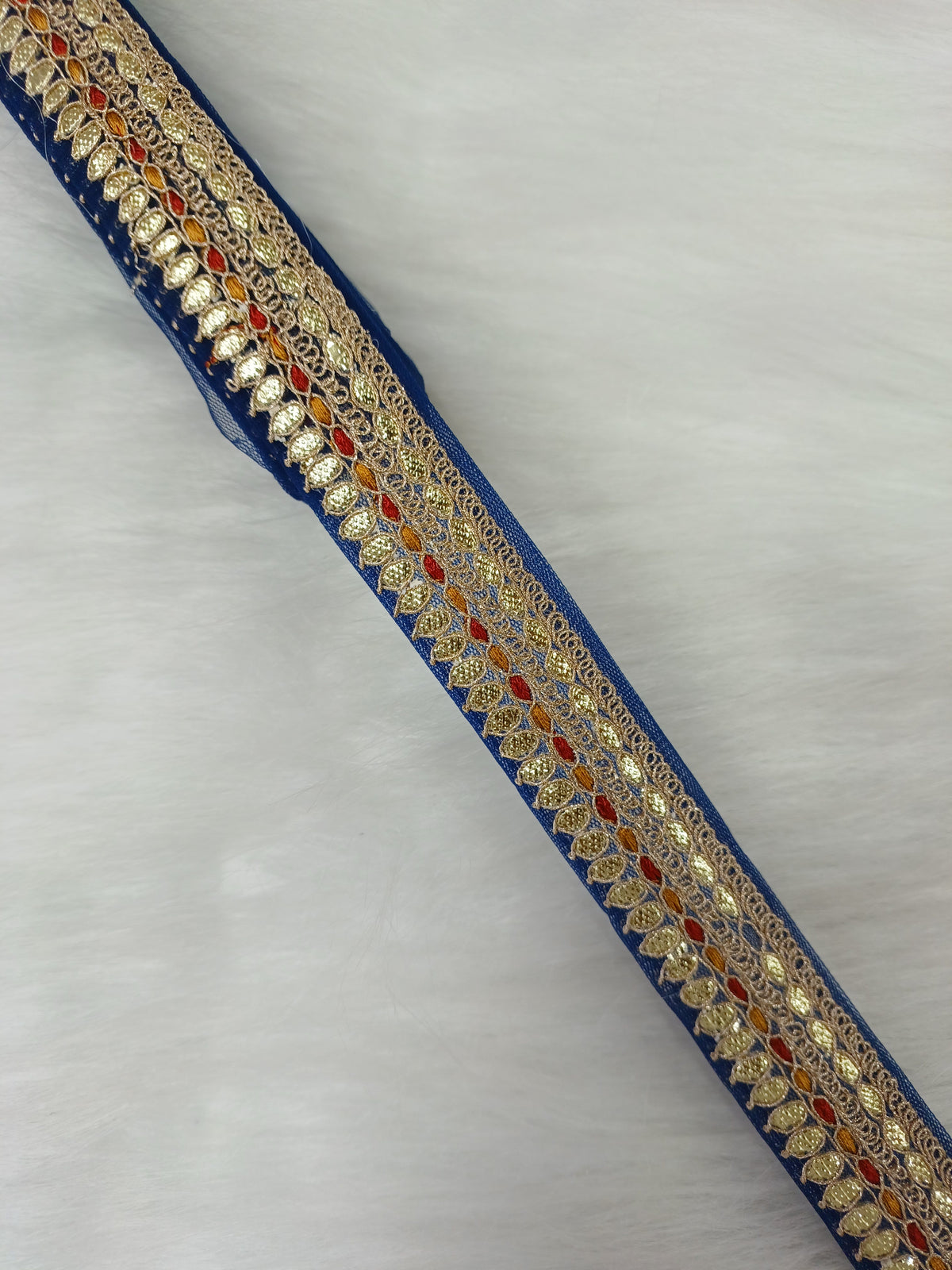 Blue lace fabric with Gota Patti embroidery from Lace Hut, featuring intricate nevi work and delicate lace details.