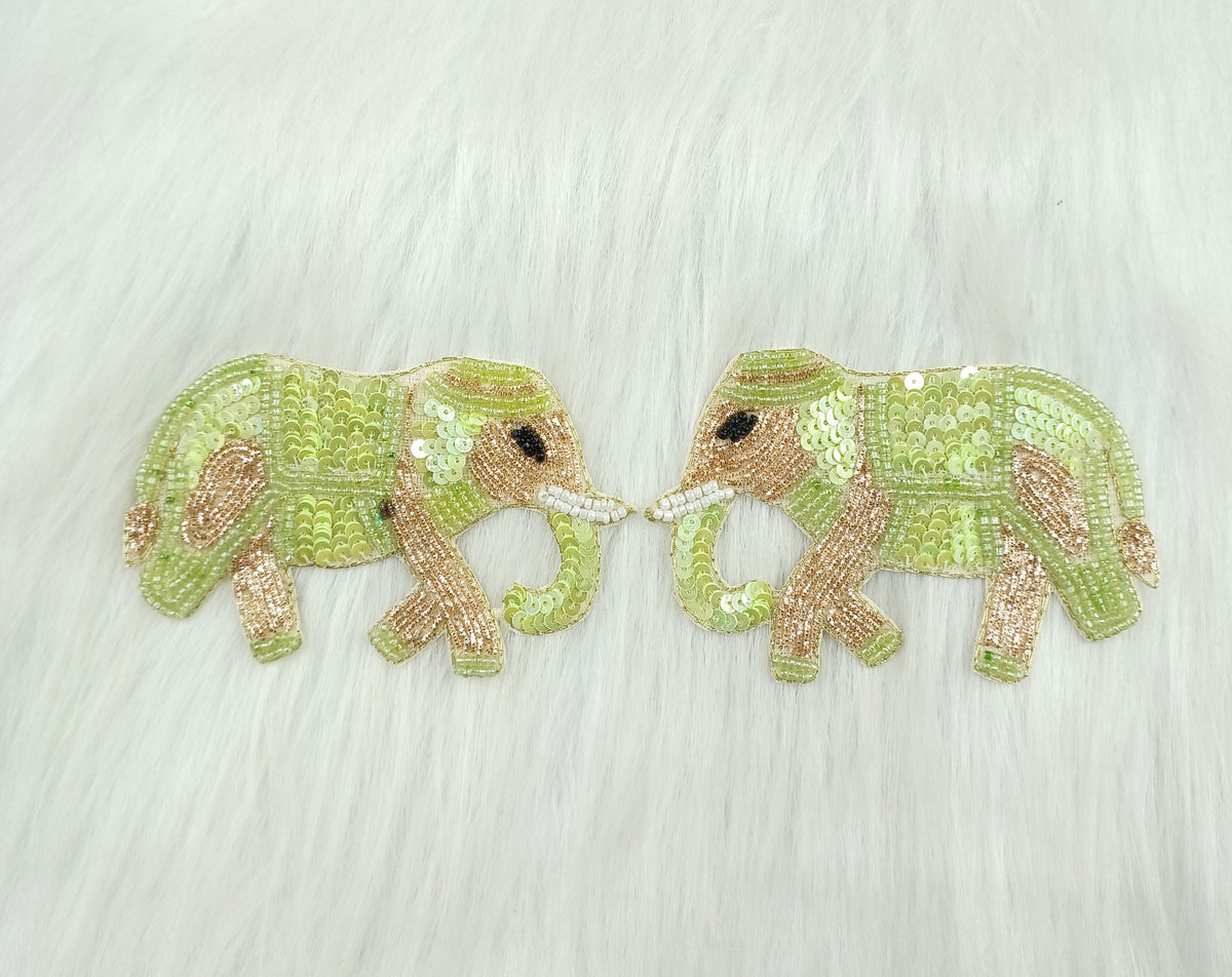 Light green Zardosi poth and sequence handwork with elephant patch from Lace Hut, detailed embroidery on fabric.