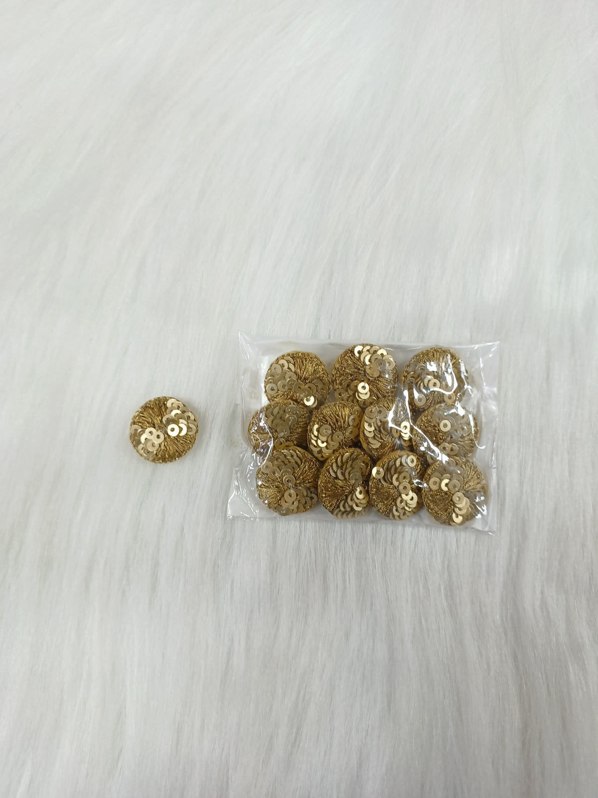 Dull golden Jari and sequence button from Lace Hut with decorative design, perfect for traditional or festive embroidery projects.