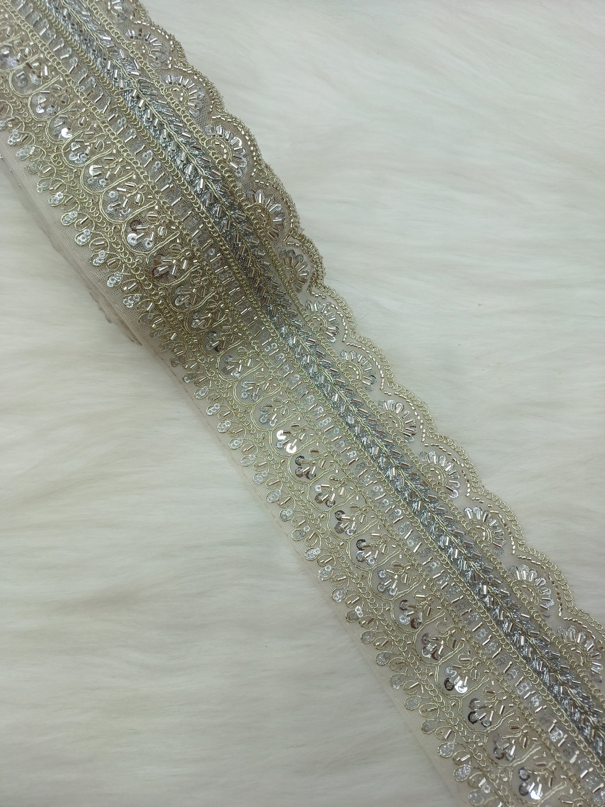 Silver lace with intricate cutdana handwork from Lace Hut, showcasing detailed embroidery and delicate craftsmanship.