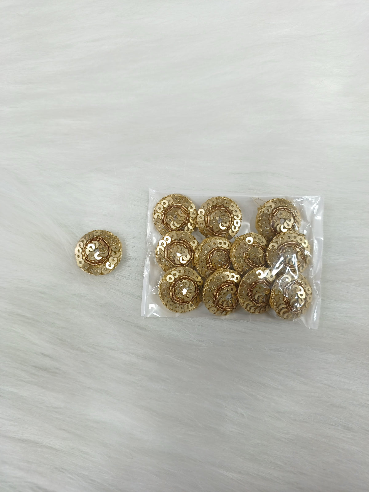 Dull golden Zardosi and sequined handwork button with intricate embroidery from Lace Hut, ideal for traditional or bridal outfits.